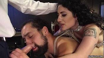 Big boobs tattooed brunette femdom Arabelle Raphael in white lingerie pegging her slave DJ in gangbang with Will Havoc then fucking over his face