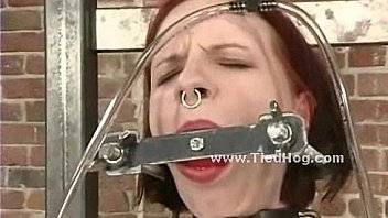 Legs spread wide in bondage to split by ropes