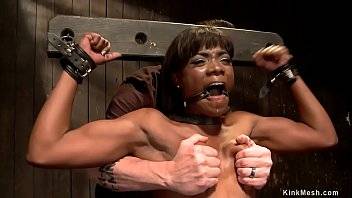 Shackled and gagged ebony slave Ana Foxxx is whipped then in back arch bondage position is zippered and vibrated by master The Pope