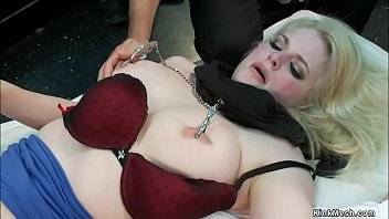 Big boobs blonde slave Danielle Delaunay is laid on mattress in public sex shop and in bondage gets anal fucked and zappered by Toni Ribas in front of crowd