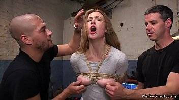 Busty brunette has slave training with two masters