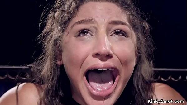 Brunette beauty in metal device bondage