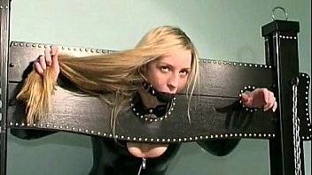 Blonde slave girl looking hot in latex
